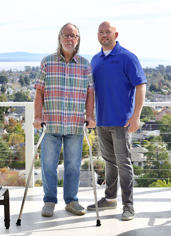 Caregiver and Man with Crutches